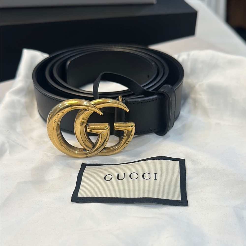 Gucci Black and Gold Leather Belt with Iconic GG Buckle